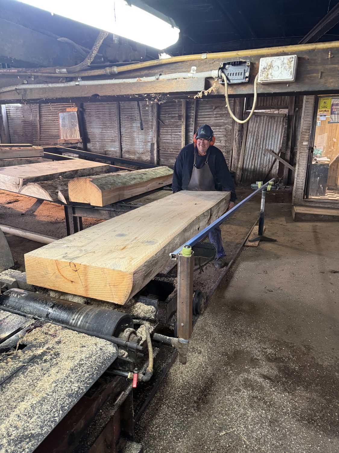 Breaking down a log into a sawn timber slab at the mill